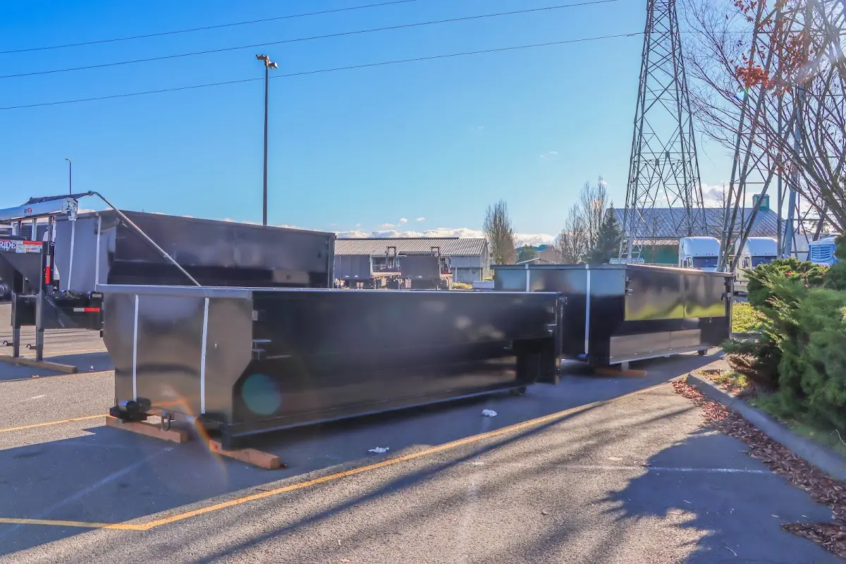 Roll-off dumpster ready for waste disposal at job site for Concrete Dumpster Rental in Piqua